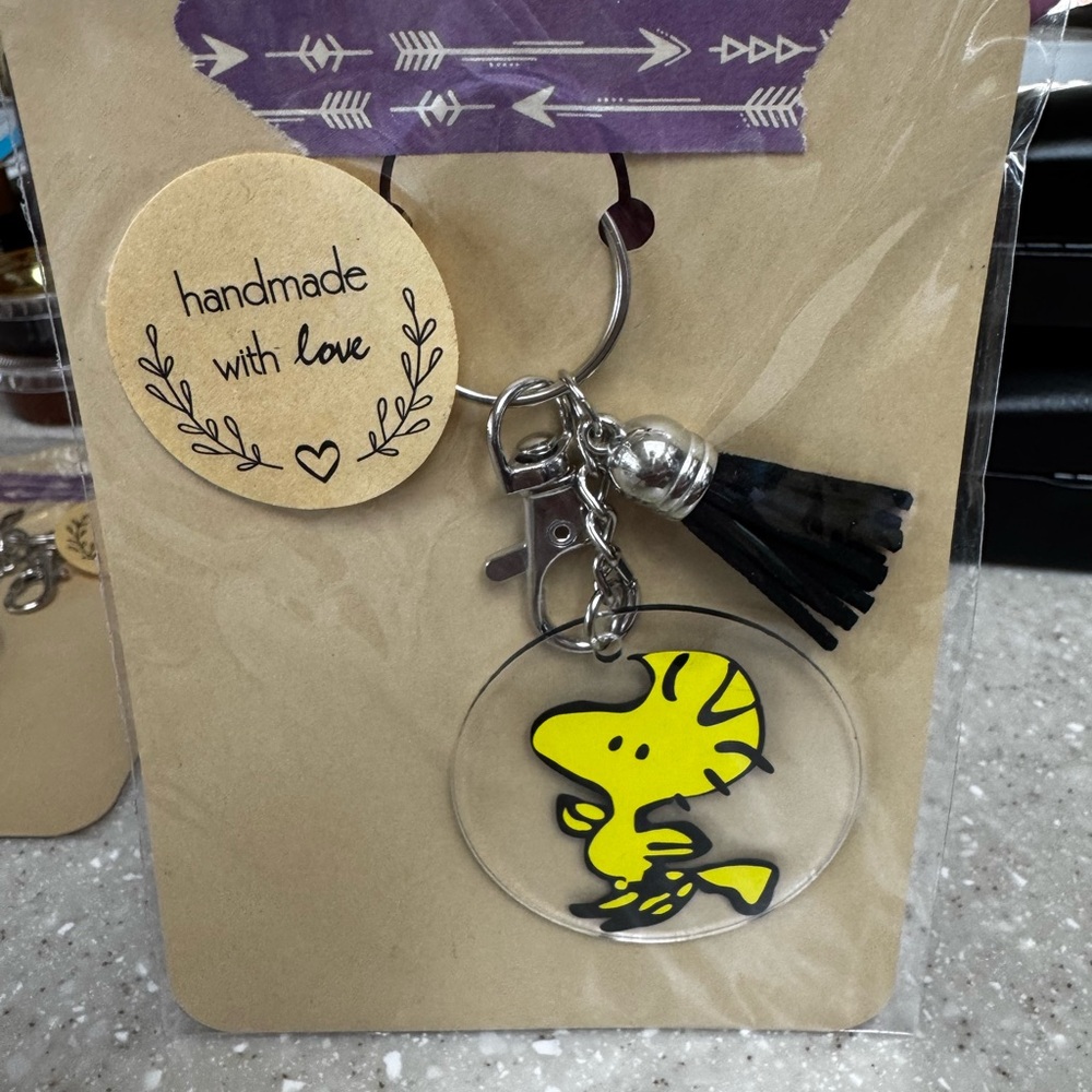 Yellow Cartoon Character Keychain with Black Tassel